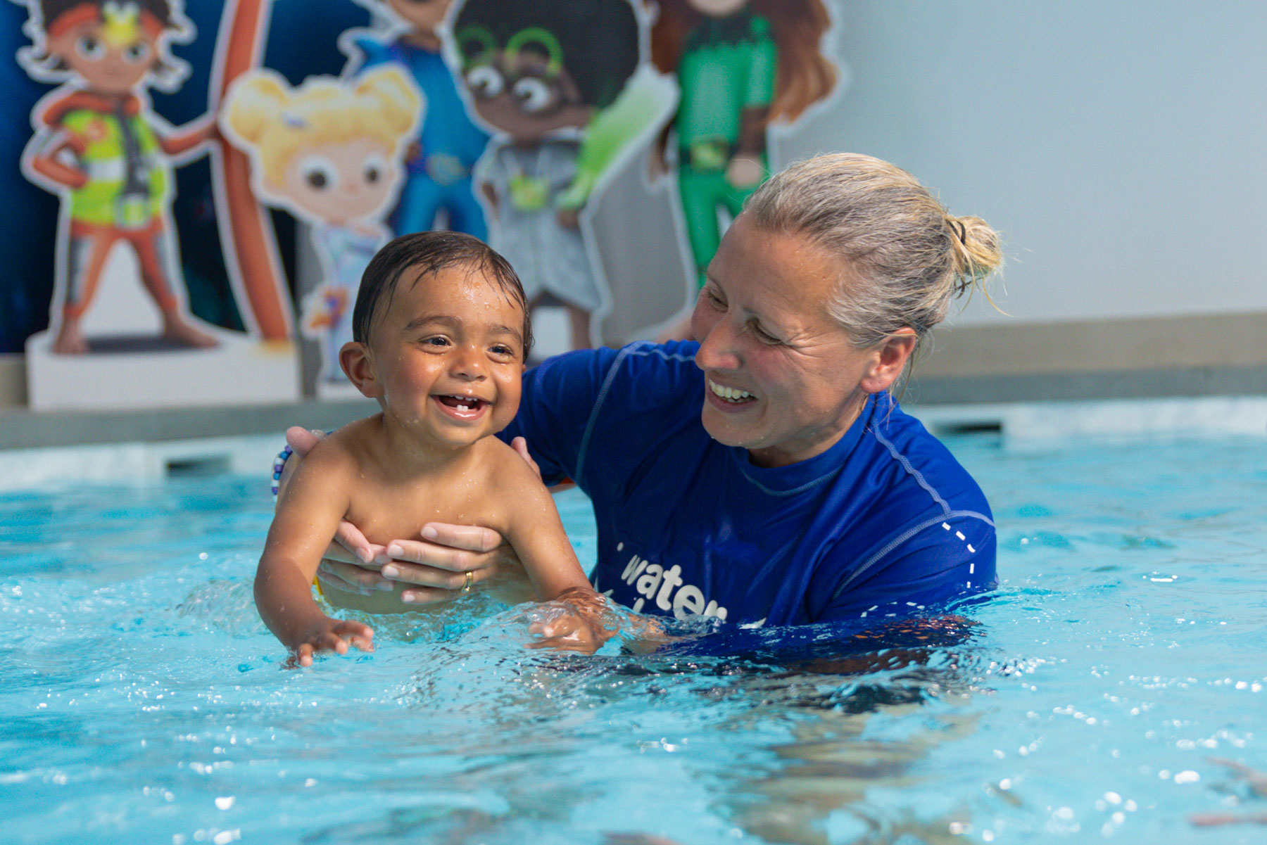 water babies teacher swimming toddler on front