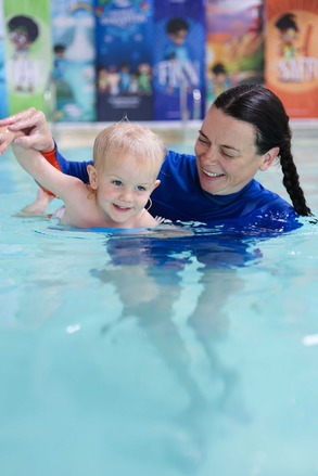 water babies teacher and toddler in the pool
