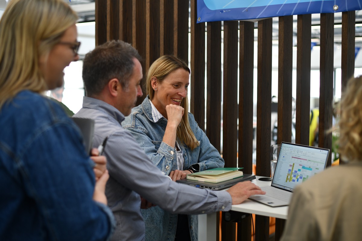 water babies head office staff standing at a desk